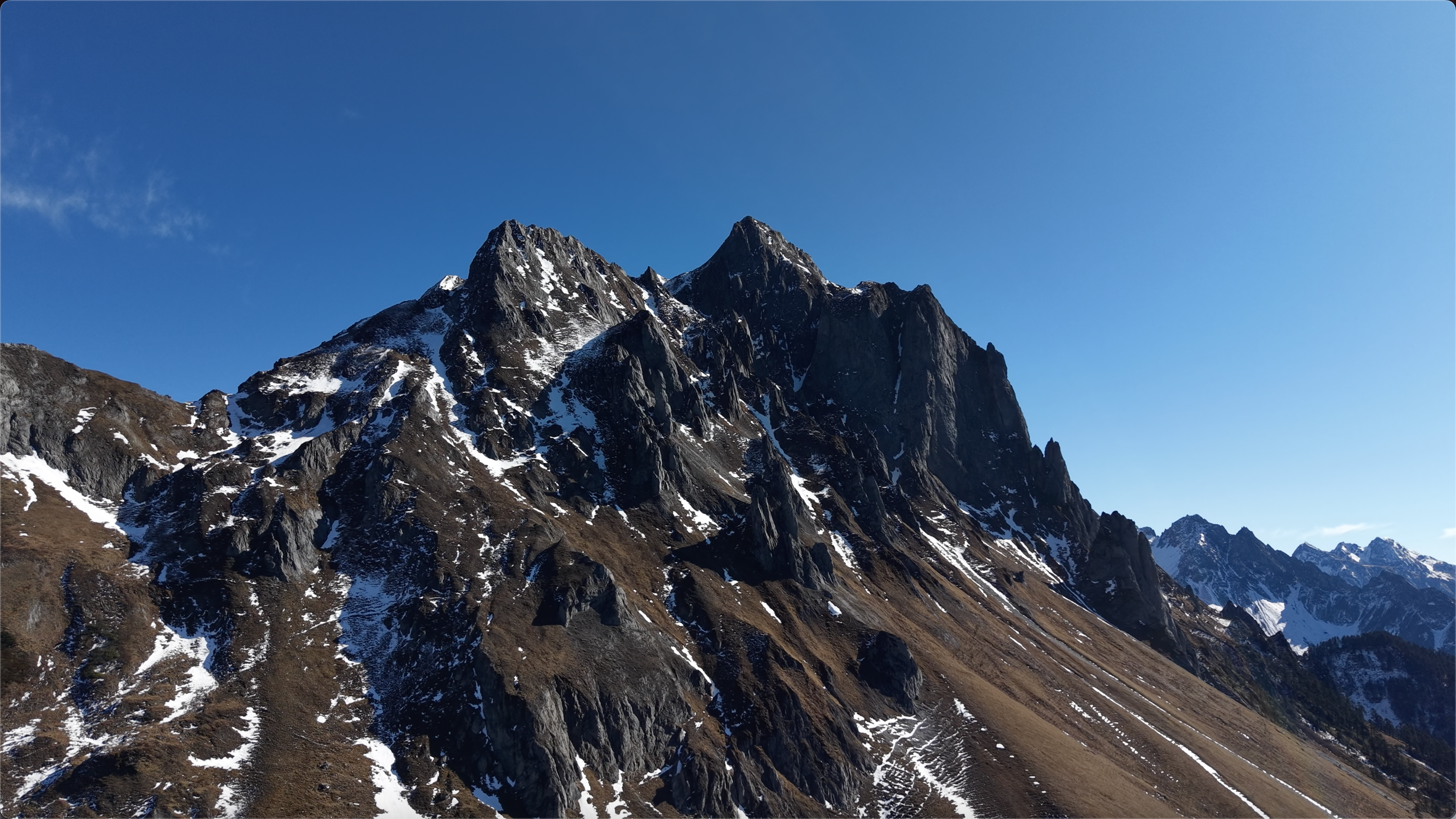 Snow peaks beneath a blue sky in Yunnan